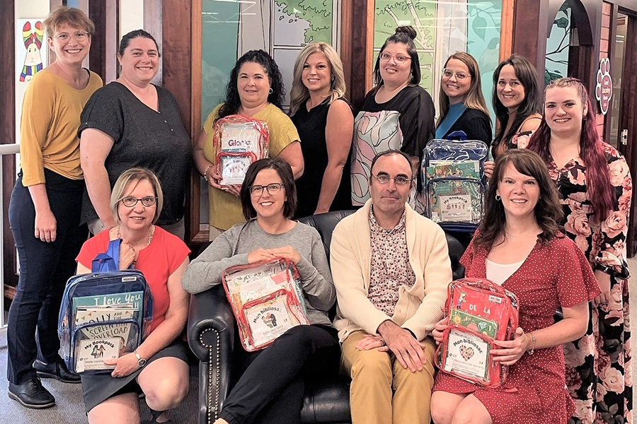 Front row, from left to right: Marcelle Bouchard, assistant, Mgr. W.J. Conway Public Library; Debbie Smyth Ringuette, member of the Resilience Action Committee; Patrick Provencher, Regional Director of Haut-Saint-Jean Library Region; and Martine Michaud, member of the Resilience Action Committee. Second row, from left to right: Édith Routhier, librarian, Haut-Saint-Jean Library Region; Sarah Dereumetz, Director of Mgr. W.J. Conway Public Library; Tina Ouellette-Plourde, member of the Resilience Action Committee; Mélanie Cyr, member of the Resilience Action Committee; Mélanie Moreau, member of the Resilience Action Committee; Karine Pelletier, member of the Resilience Action Committee; Véronic Boucher, dietitian; and Véronique Thibault, member of the Resilience Action Committee.