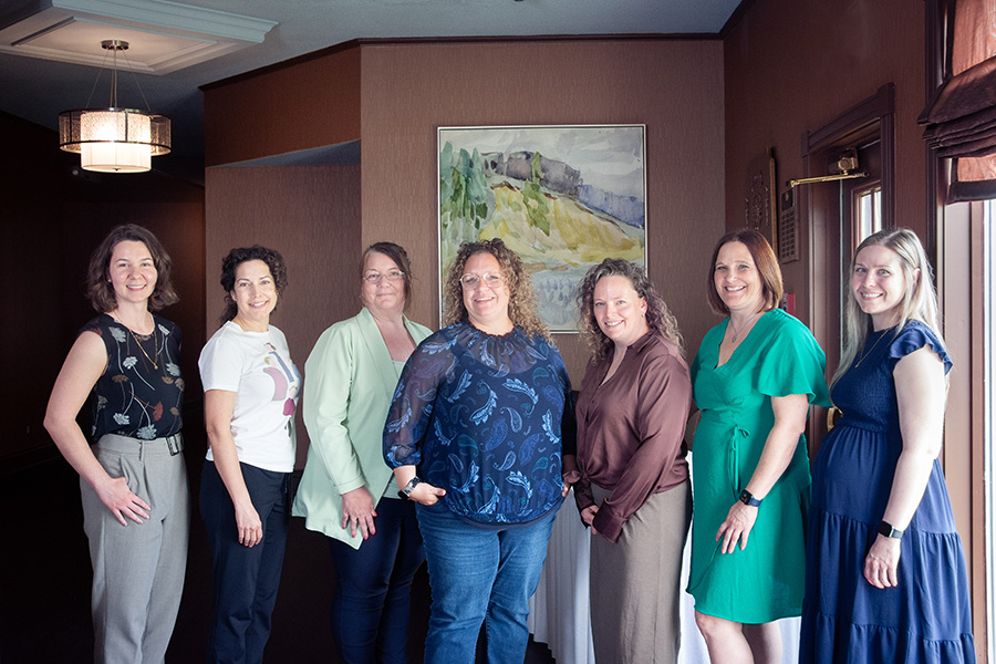 from left to right: Émilie Warren, Acting Manager, Community Health Needs Assessments; Marie-Josée Roussel, Manager of Hospital Activities, Lamèque Hospital and Community Health Centre; Stéphanie Roy, Corporate Director, Primary Health Care, Palliative Approach and Integrated End-of-Life Care; Mélanie Ruest, Acting Executive Director, Northwest Regional Services Commission; July Synnott, Engagement and Change Management Consultant; Annie Roussel, Public Health Assistant Director; Joanie Gagnon, Director, Organizational Planning.